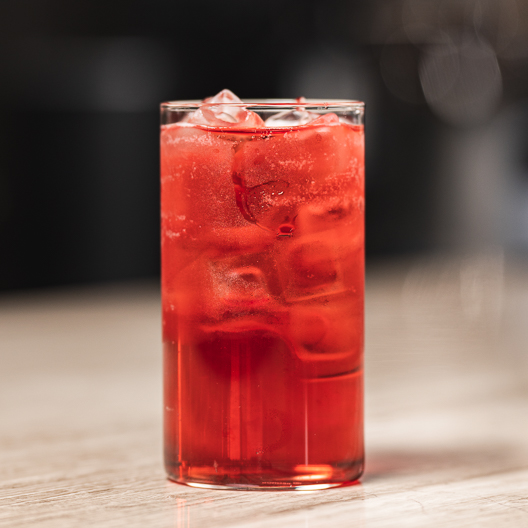 Toddy hibiscus tea on ice in glass