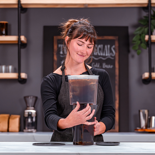 Toddy Essential Brewer-Food Service Edition Barista Draining Coffee Concentrate into Pitcher