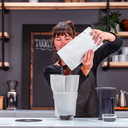 Toddy Essential Brewer-Food Service Edition Barista Pouring Coffee into Brewer